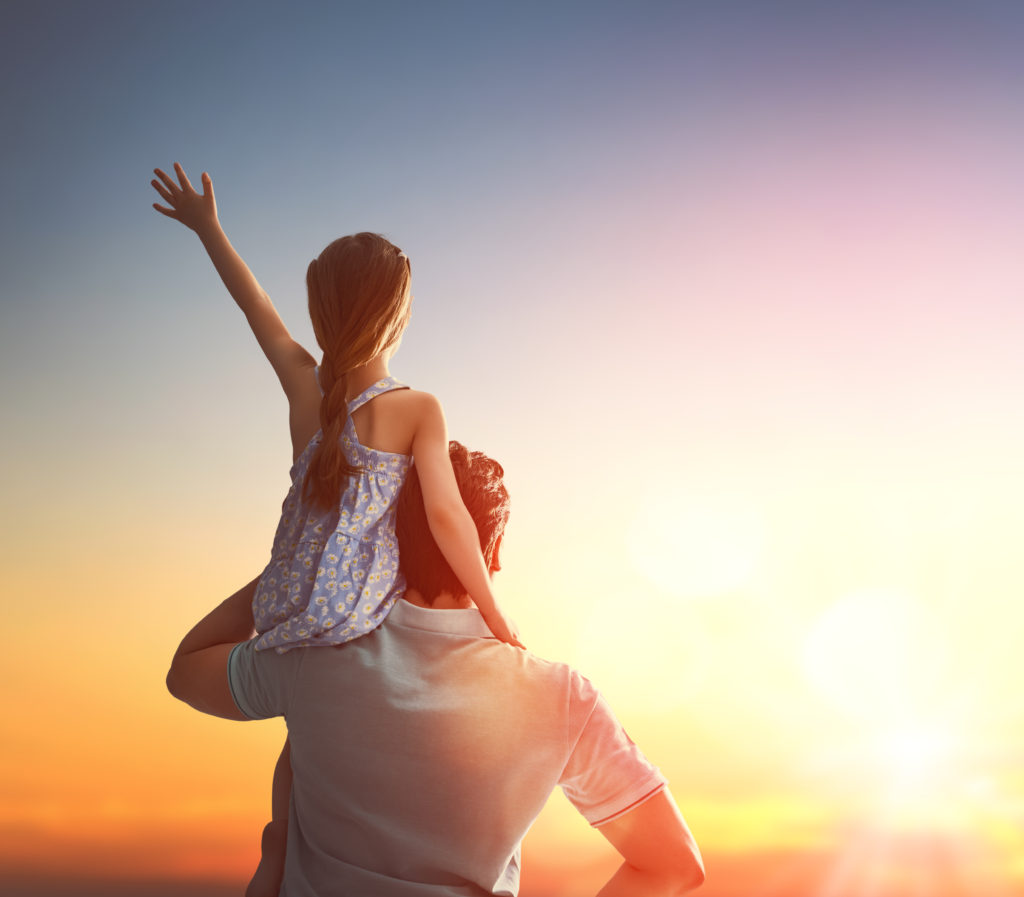 Happy loving family. Father and his daughter child girl playing and hugging outdoors. Cute little girl and daddy. Concept of Father's day.